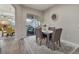 Casual dining area with gray chairs and an area rug at 438 Grand Preserve Cv, Bradenton, FL 34212