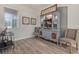Well-appointed home bar with liquor display, bar cart, and seating at 438 Grand Preserve Cv, Bradenton, FL 34212