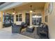 Covered lanai with comfortable seating and ceiling fans at 438 Grand Preserve Cv, Bradenton, FL 34212