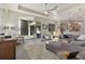 Bright and airy living area with access to the patio and kitchen at 438 Grand Preserve Cv, Bradenton, FL 34212