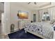 Spacious main bedroom with large TV, dresser, and comfortable bedding at 438 Grand Preserve Cv, Bradenton, FL 34212
