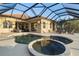 Resort-style pool and spa with covered lanai at 438 Grand Preserve Cv, Bradenton, FL 34212
