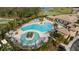 Aerial view of resort-style pool with lounge chairs and landscaping at 438 Grand Preserve Cv, Bradenton, FL 34212