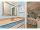 Bathroom with vanity and view into bedroom at 440 Palmetto Ct # 3, Venice, FL 34285