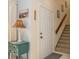 Entryway with staircase, a small table, and a lamp at 440 Palmetto Ct # 3, Venice, FL 34285