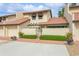 Condo with Spanish-style architecture, attached garage, and well-maintained landscaping at 440 Palmetto Ct # 3, Venice, FL 34285