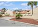 Attractive two-story building with terracotta tile roofs and neatly landscaped grounds at 440 Palmetto Ct # 3, Venice, FL 34285