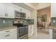 Modern kitchen with stainless steel appliances and view to dining area at 440 Palmetto Ct # 3, Venice, FL 34285