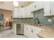 Updated kitchen with granite counters and mosaic backsplash at 440 Palmetto Ct # 3, Venice, FL 34285