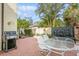 Outdoor patio with seating, a fountain, and a grill at 440 Palmetto Ct # 3, Venice, FL 34285