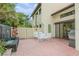 Brick patio with fountain, seating area, and grill at 440 Palmetto Ct # 3, Venice, FL 34285