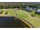 Aerial view showing home's location on golf course at 441 Tremingham Way, Venice, FL 34293