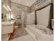 Elegant bathroom with soaking tub, shower, and updated fixtures at 441 Tremingham Way, Venice, FL 34293