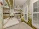 Bathroom with tropical mural and shutters at 441 Tremingham Way, Venice, FL 34293