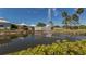 Resort-style pool with fountain and lush landscaping at 441 Tremingham Way, Venice, FL 34293