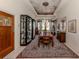 Formal dining room with painted ceiling and large windows at 441 Tremingham Way, Venice, FL 34293
