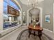 Entryway view of pool and garden through stained glass window at 441 Tremingham Way, Venice, FL 34293
