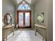 Elegant entryway with double doors and sidelights at 441 Tremingham Way, Venice, FL 34293
