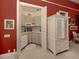 Small kitchenette with white cabinets at 441 Tremingham Way, Venice, FL 34293