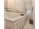 Bright laundry room with built-in cabinets and ample counter space at 441 Tremingham Way, Venice, FL 34293