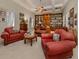 Spacious library with wooden built-ins and seating at 441 Tremingham Way, Venice, FL 34293