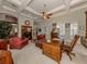 Library with wooden desk, seating, and built-in shelves at 441 Tremingham Way, Venice, FL 34293