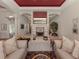 Living room with fireplace and seating area at 441 Tremingham Way, Venice, FL 34293