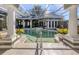 Luxury pool and spa with covered patio at 441 Tremingham Way, Venice, FL 34293