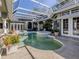 Resort-style pool area with lush landscaping at 441 Tremingham Way, Venice, FL 34293