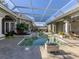 Relaxing pool and spa area with a covered patio at 441 Tremingham Way, Venice, FL 34293