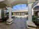 Inviting pool area with a covered patio and lush landscaping at 441 Tremingham Way, Venice, FL 34293