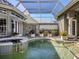 Relaxing pool and spa with painted mural at 441 Tremingham Way, Venice, FL 34293