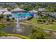 Resort-style pool with deck, lounge chairs and fountain at 441 Tremingham Way, Venice, FL 34293