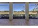 Screened porch with golf course view at 441 Tremingham Way, Venice, FL 34293