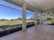 Enjoy golf course views from this porch at 441 Tremingham Way, Venice, FL 34293