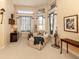 Relaxing sitting room with chaise lounge, large windows, and tranquil atmosphere at 441 Tremingham Way, Venice, FL 34293