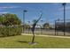Tennis courts with modern sculpture, ready for a game at 441 Tremingham Way, Venice, FL 34293