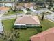 Single-story home with tile roof and screened porch at 5045 Whitestone Dr, Venice, FL 34293