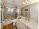 Guest bathroom with tub, shower, and single vanity at 5045 Whitestone Dr, Venice, FL 34293