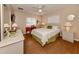 Guest bedroom with queen-size bed, wood floors and built-in desk at 5045 Whitestone Dr, Venice, FL 34293