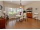 Bright dining room with hardwood floors and seating for six at 5045 Whitestone Dr, Venice, FL 34293