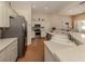 Modern kitchen with stainless steel appliances and light cabinets at 5045 Whitestone Dr, Venice, FL 34293