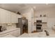 Well-equipped kitchen featuring stainless steel appliances and ample counter space at 5045 Whitestone Dr, Venice, FL 34293