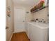 Laundry room with washer, dryer, and shelving at 5045 Whitestone Dr, Venice, FL 34293