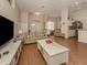 Open concept living room with a view into the kitchen and dining area at 5045 Whitestone Dr, Venice, FL 34293