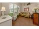 Cozy office space with a comfy chair, sofa, and natural light at 5045 Whitestone Dr, Venice, FL 34293