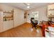 Home office with desk, wall bed, and built-in shelving at 5045 Whitestone Dr, Venice, FL 34293