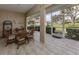 Spacious screened-in porch with patio furniture at 5045 Whitestone Dr, Venice, FL 34293