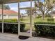 View from screened porch overlooking backyard at 5045 Whitestone Dr, Venice, FL 34293