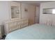 Bright bedroom with dresser and large bed at 516 Ashwood Dr, Venice, FL 34285